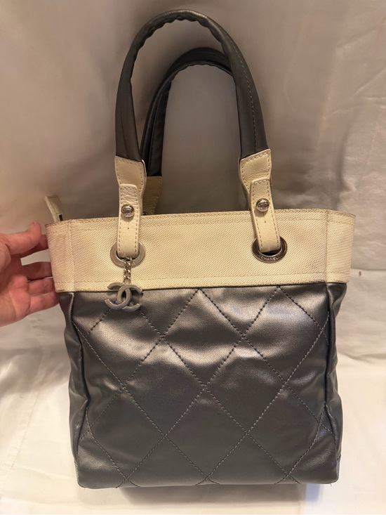 CHANEL Handbags - CHANEL Quilted Metallic Silver and Cream Tote Bag with CC Charm